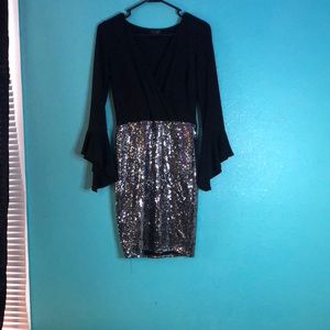 A mini black shiny dress